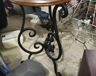 . . . a nice wood-topped table with a wrought-iron base -- cute.