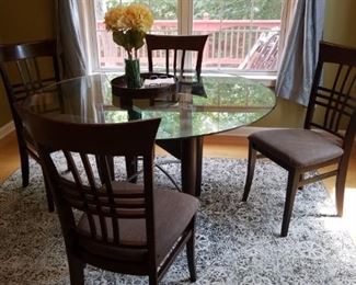 Glass top round table and chairs great for kitchen or dining room