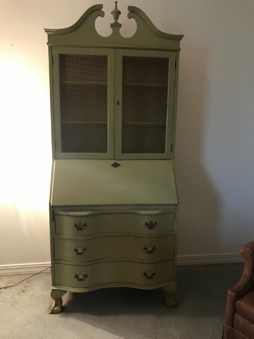 1940s era, solid wood secretary. Painted moss green, metal mesh covering for doors. Six mail slots, three tiny drawers, three bottom drawers, three shelves. Clay-style feet. Original hardware; keys are missing. Measures 72" high, 32" wide.  See next photos for more detail.