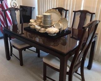 Oriental style table w/6chairs
2 leaves and custom table pads
