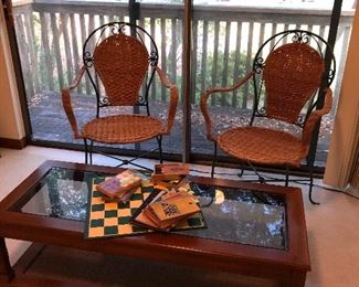Pr iron and wicker chairs glass top coffee table old checker sets and game books