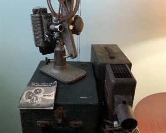 Revere movie camera and a vintage slide projector