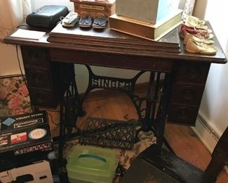 Antique Singer sewing machine and cabinet (see sewing machine next photo); selection of vintage baby shoes.