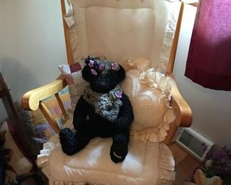 Rocking chair with black teddy bear (Steiff?).