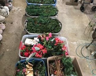 Tubs packed with Christmas wreaths, bows, flowers, etc.