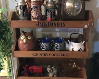 Jack Daniels wood display shelf; German steins including MR 722; Seth Thomas clock.