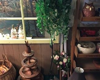 Four-tier hand-carved serving tray (from the Philippines, I think); metal standing plant hanger; vintage cuckoo clock.
