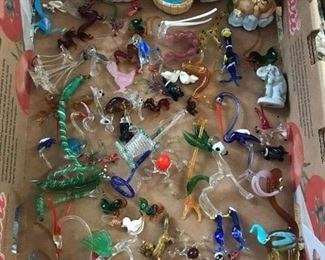 Collection of miniature glass figurines.