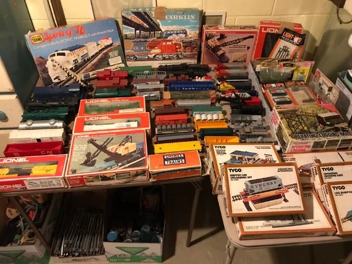 Large collection of model trains, including Lionel, Marklin and more.  Close-up photos of these items, including a photo of additional model train components, can be seen below.