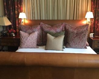 SLEIGH BED, LEATHER WITH UPHOLSTERY NAIL HEADS. MINT CONDITION. BEDDING IS NOT INCLUDED.