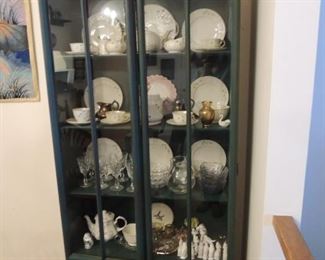 vintage china cabinet with collections