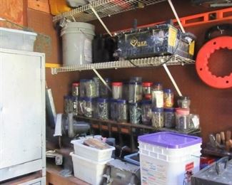 tons of tools, nails, etc. There's a shed and garage