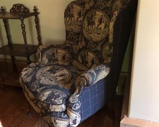 Upholstered arm chair with accent table.  