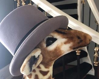A fun 4' giraffe sports a beautiful top hat.  Come have fun with us!