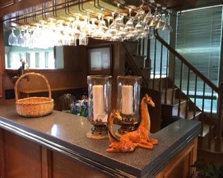Fully stocked bar is decorated with giraffes that will bring a smile to your face.  