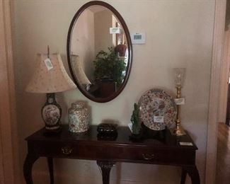 Antique and contemporary decor adorn this Sherrill library console table 