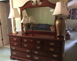 Cherry Hill Bedroom Suite includes two bedside tables with drawers, 11-drawer bureau, dresser with mirror and queen bed.  