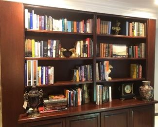 LOTS of books along with beautiful bookshelf decor.  