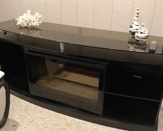 Tv center with integral holographic fireplace which projects heat!! Beautiful works great ! 