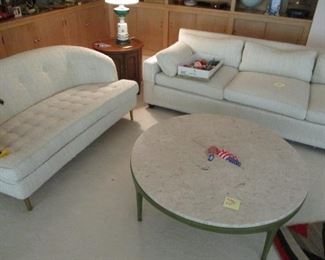 Dunbar Settee and a marble top coffee table.