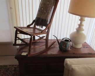 Cane rocker carved chest