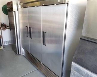 #602: True Stainless Steel 3 Door Refrigerator Model T-72
Measures approximately 78"×30"×80",