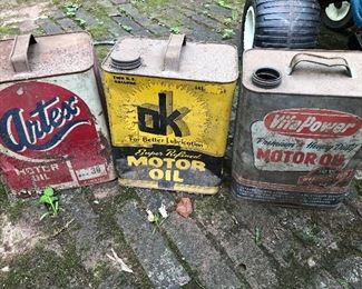 Several metal Oil Cans