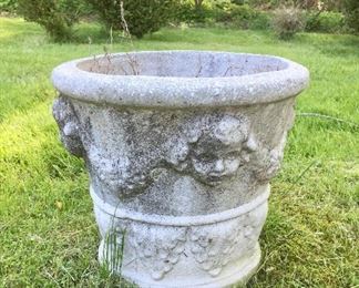 One of a pair of concrete flower pots.