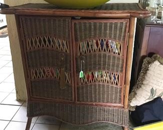A great little wicker cabinet.  Full,of cook books also.