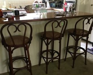 3 bar stools with cane seats.  In prefect condition.