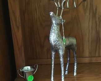 Silver deer with candler holders in antlers.