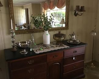 Items on buffet with silver.