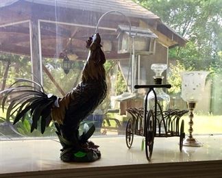 A metal rooster. With metal basket.