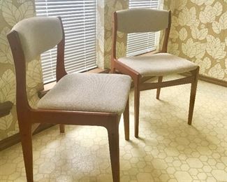 There are a pair of these mid century teak dining chairs