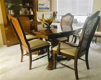 Six high back cane chairs and basket woven inlay dining table. mid century,  top quality