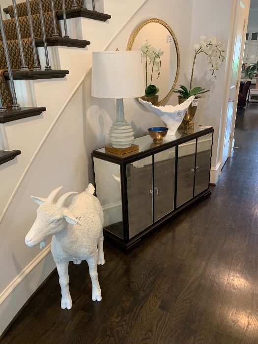 Mirrored buffet/entry piece. Welcoming white goat. 