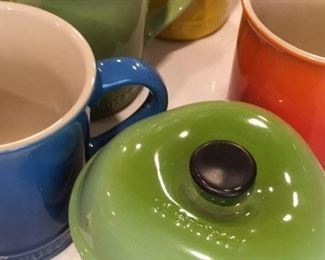 Coffee mugs and small covered casserole by Le Creuset
