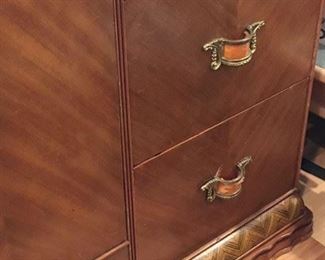 Detail of the footed bottom of Art Deco wardrobe