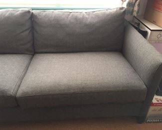 Sofa in medium gray fabric by Crate & Barrel