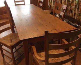 French Country harvest table that seats six, with six high back chairs with rush seats