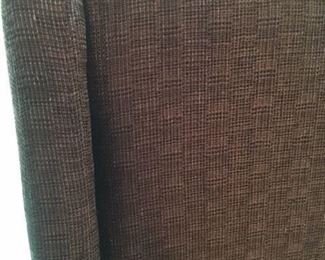 Detail of fabric on four chocolate color upholstered dining chairs