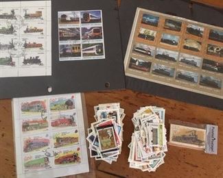 Assortment of locomotive/train stamps in sheet form and bagged lots (100 in a bag)