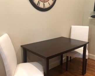 Great little table and two clean white chairs.  $150. All
Clock. $50