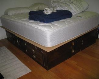 Queen mattress on waterbed base for storage