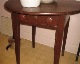 Small round table with one drawer