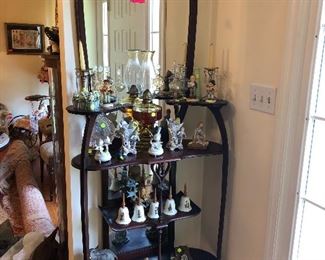 wooden etagere with mirror, oil lamp, vintage figurines