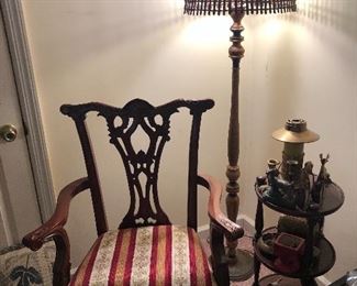 ornate arm chair, side table, lamp