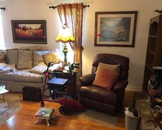 sofa, leather recliner, small foot stool, rolling walker