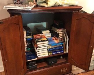 entertainment center, books, quilts