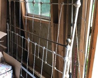 antique iron bed and rails, fishing rods and reels